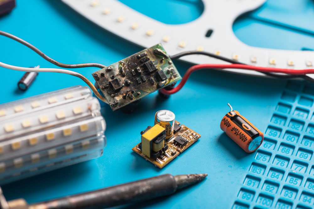 Remove a damaged capacitor on a circuit board. 