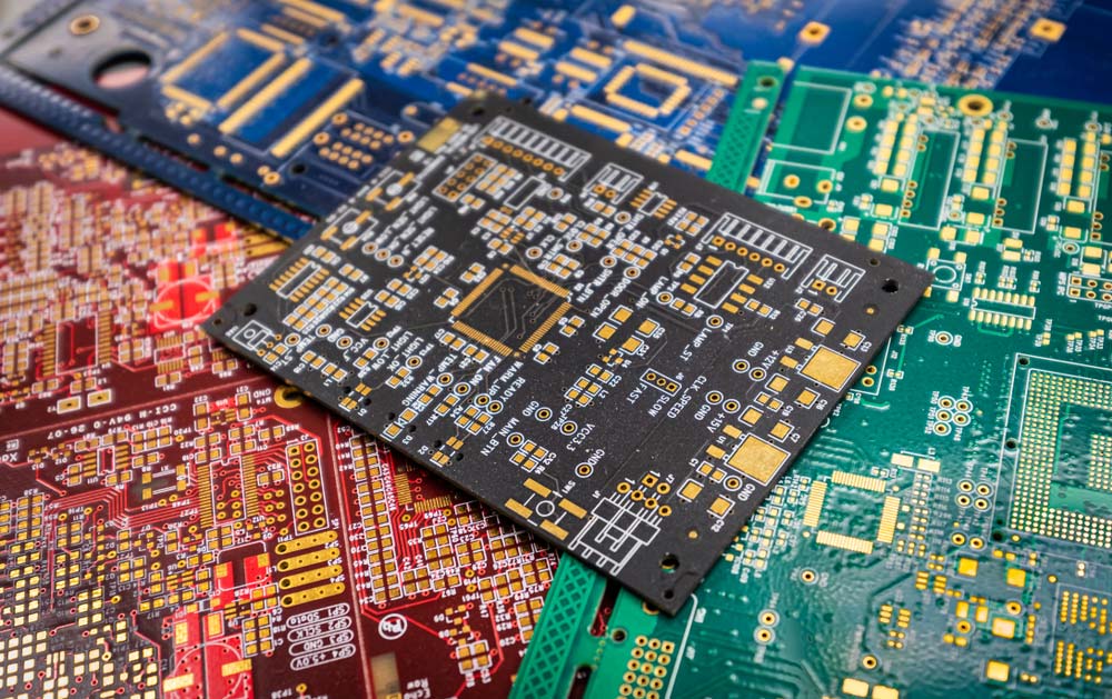 Several bare PCBs are ready for testing.v