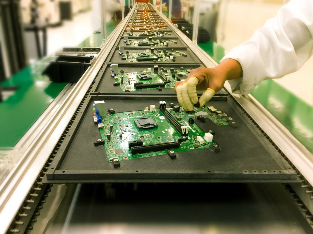 Circuit boards in an assembly line before wave soldering