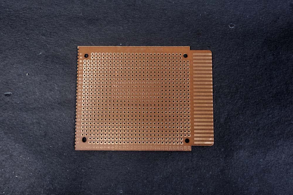 A dot or perforated PCB, which you can use for making and testing electronic circuits.