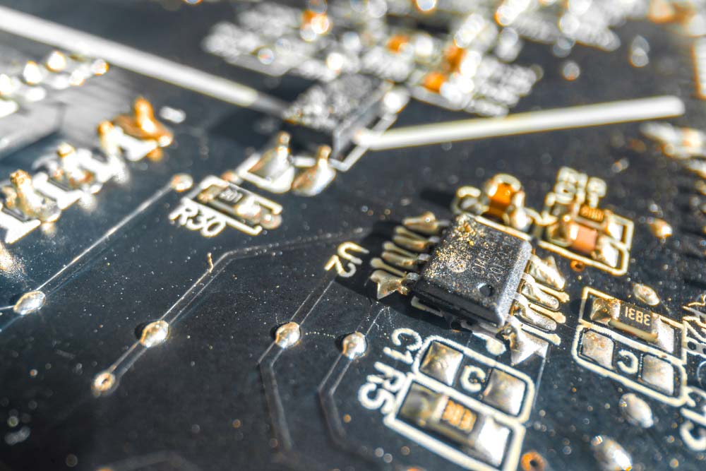 A close-up image of a corroded PCB