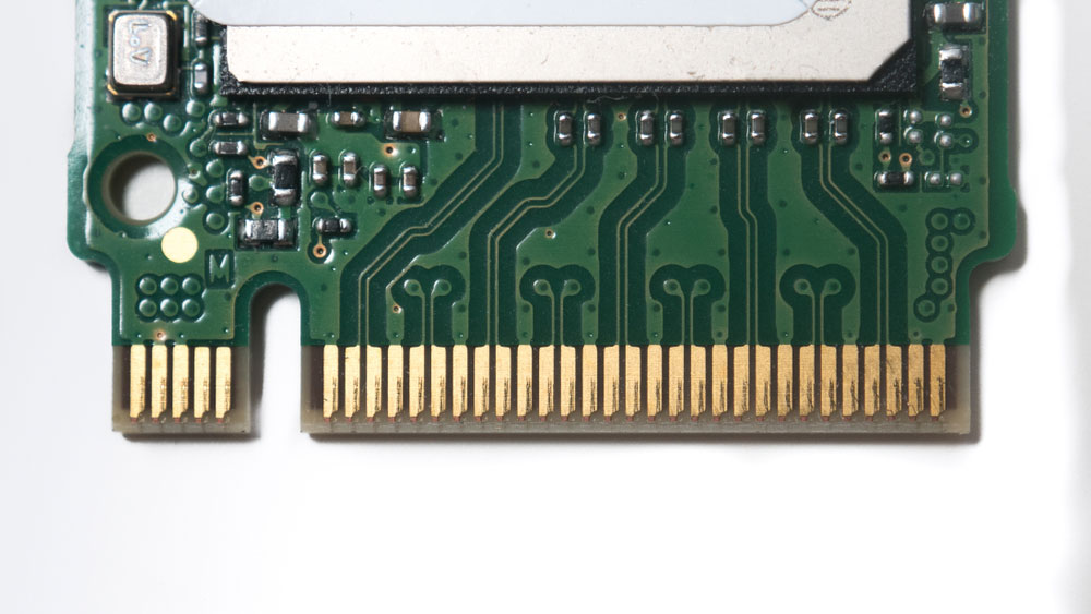 An NVMe M2 SSD PCB with edge plating on the upper side