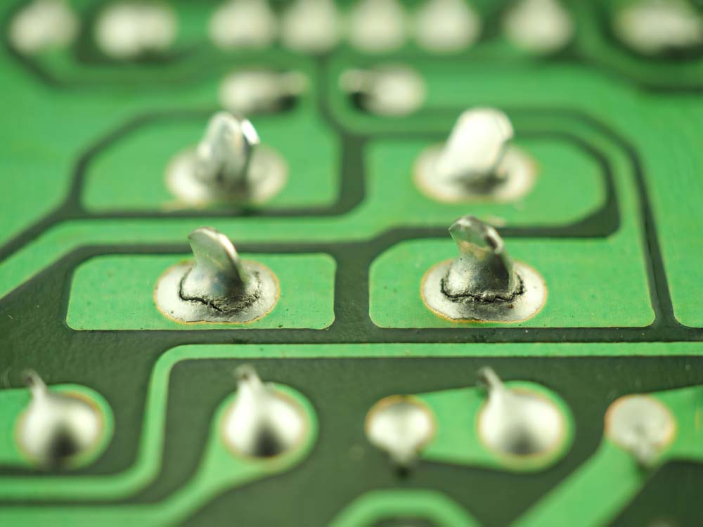 Cracked solder joints on a PCB.