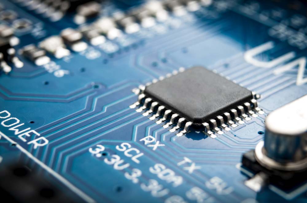 A semiconductor microchip mounted on a PCB.