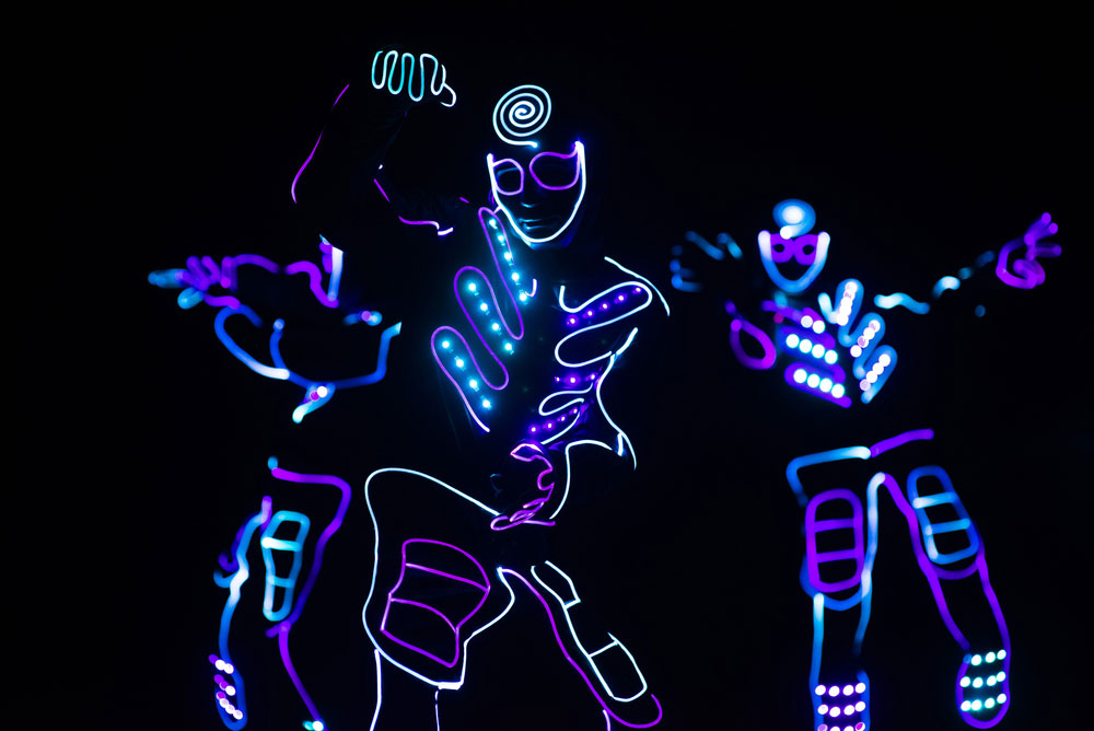 Dancers in LED light suites