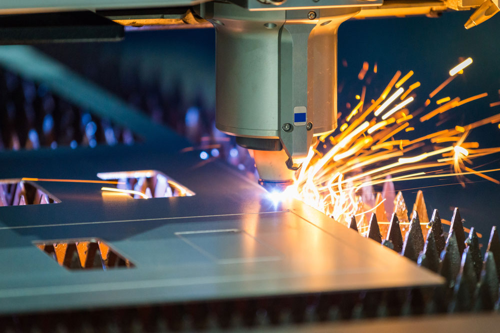 A CNC laser cutter in action