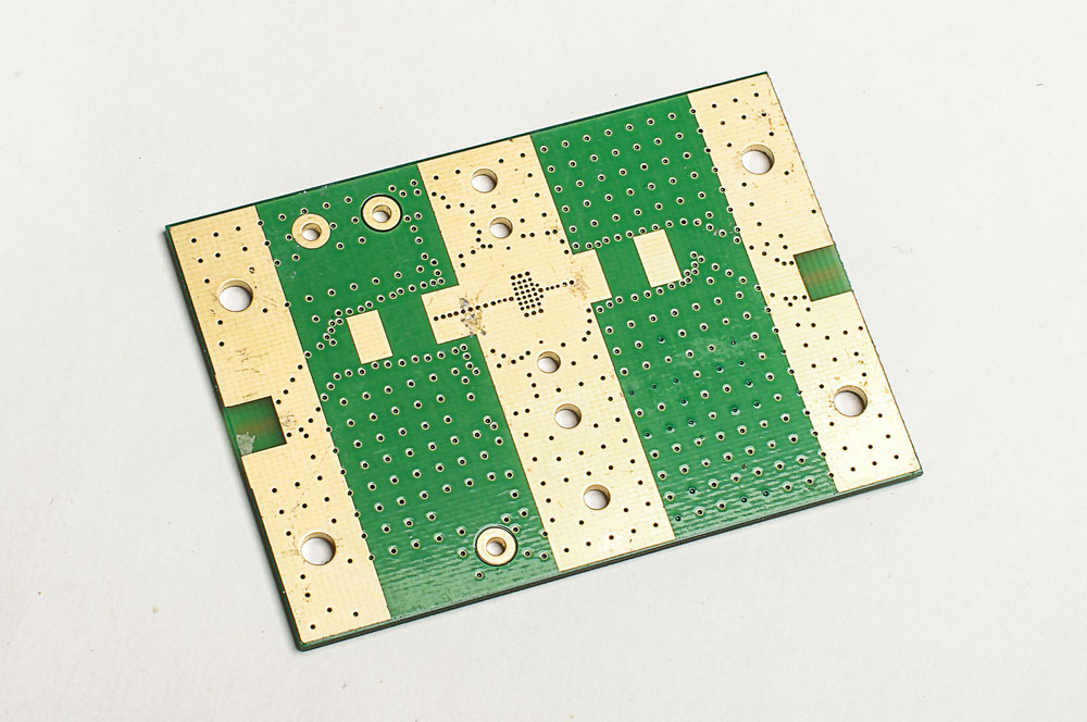The bottom layer of a PCB with broad copper tracks