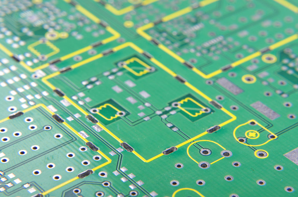 An up-close image of a PCB with multiple vias