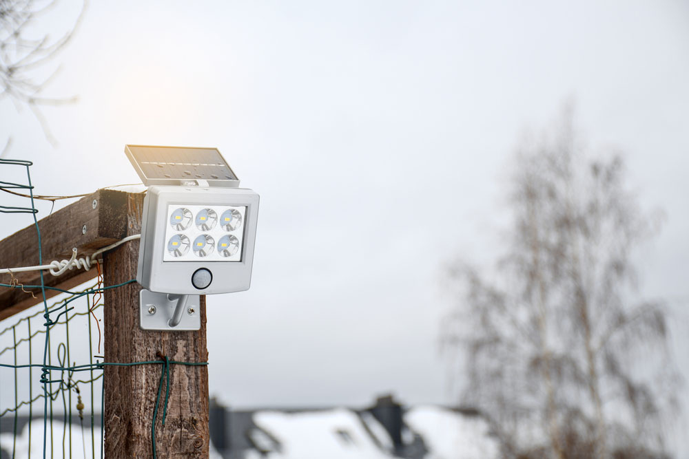 A solar panel garden light with a motion sensor