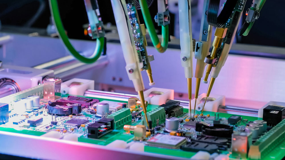 An up-close shot of a flying probe system testing an assembled PCB