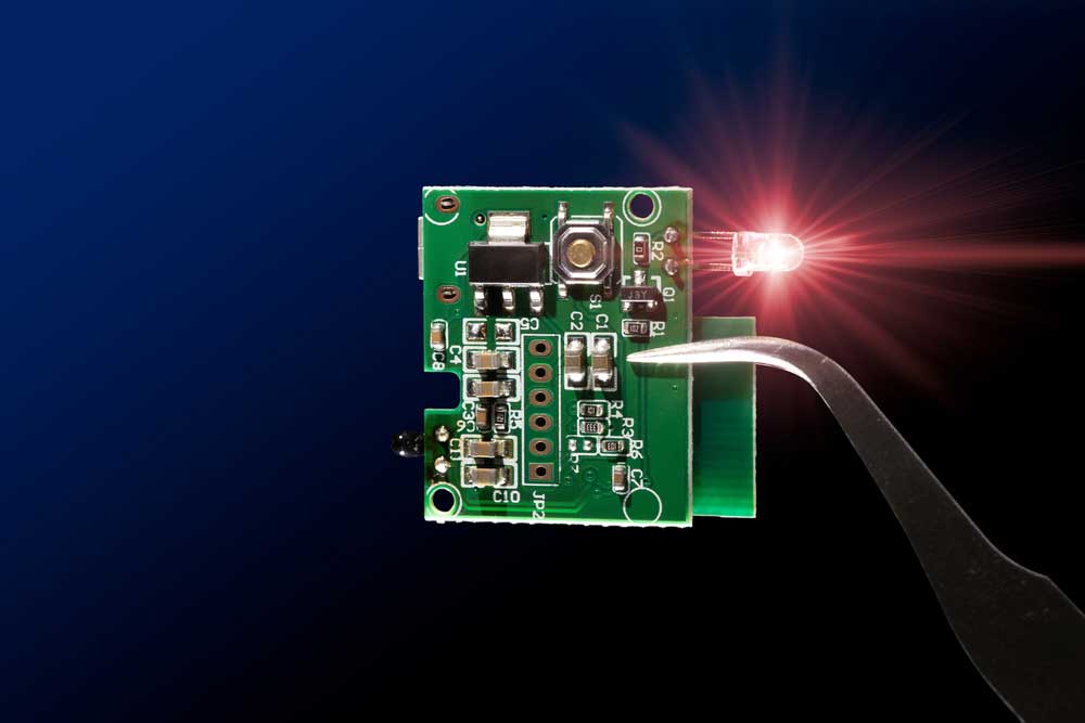 A microcontroller circuit board with an infrared LED