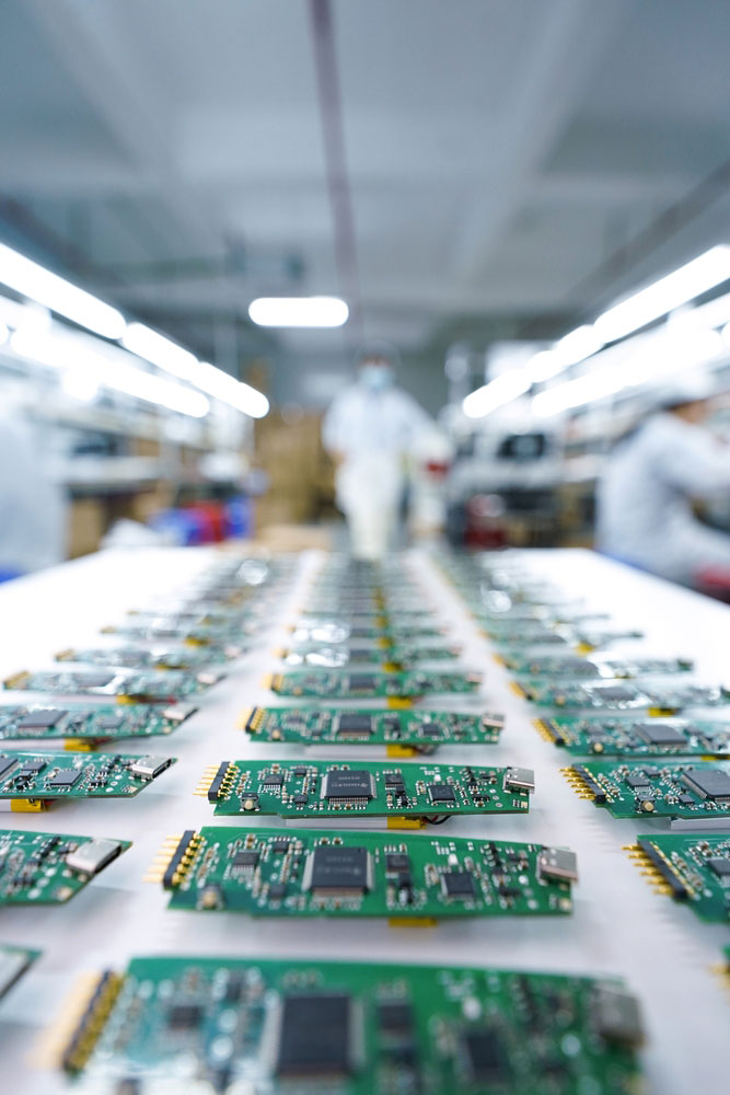 Several PCBs under production in a factory