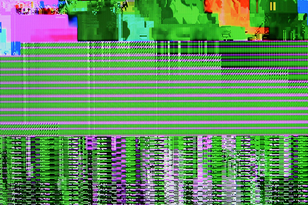 A signal on a TV screen with noise corruption