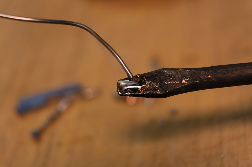 A soldering iron with a silver solder