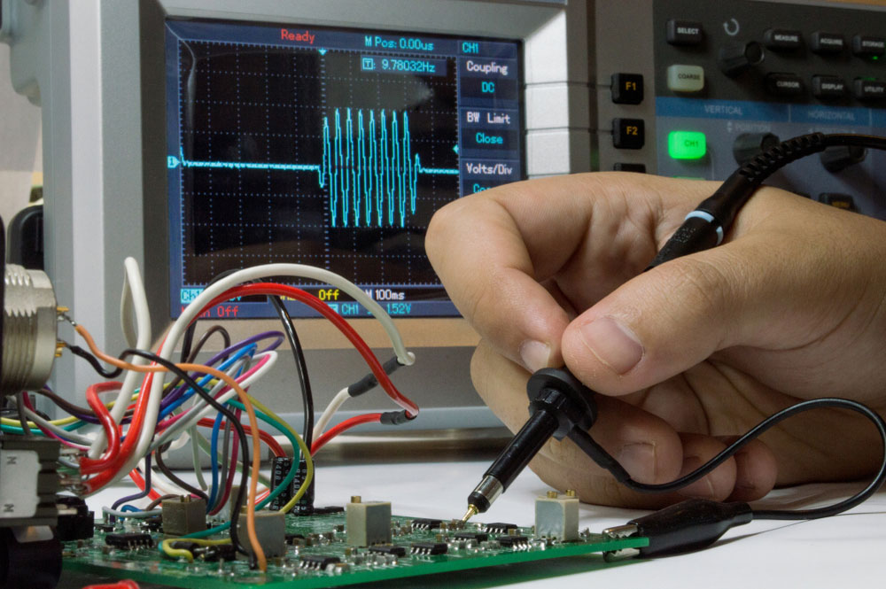 An oscilloscope probe assessing a circuit in the signal waveform