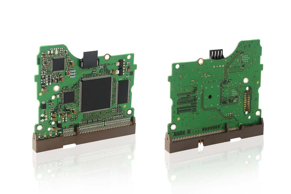 Two circuit boards with components soldered on board, including a QFP-packaged chip.