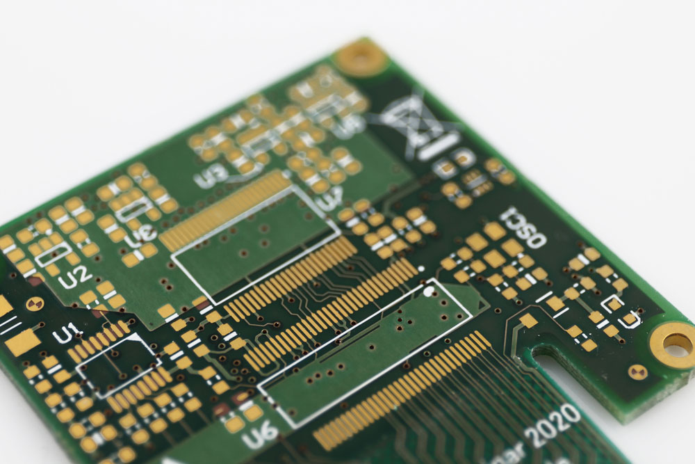 A circuit board with gold-plated pads and contact points