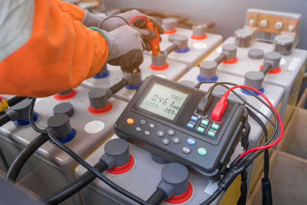 A technician measuring the internal resistance of secondary batteries (rechargeable batteries)