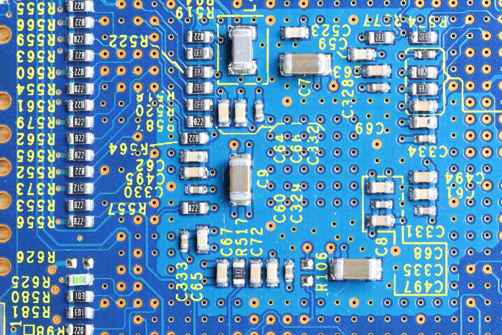 Surface-mount devices soldered on a blue PCB
