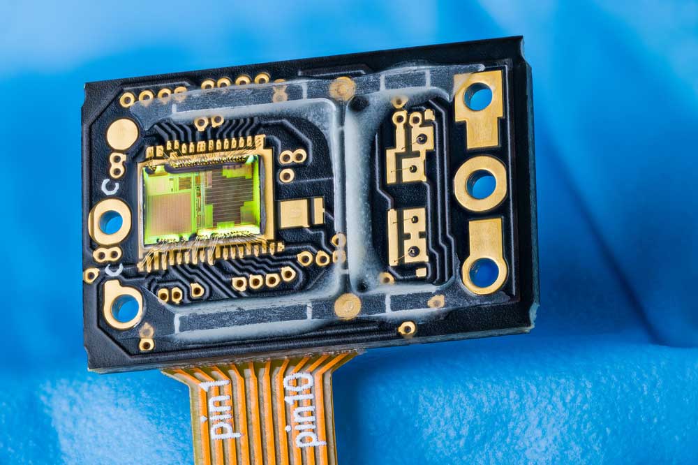 An optoelectronic image sensor PCB with a green silicon die